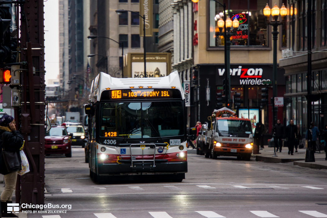 Bus #4306 at Monroe and Wabash, working route #J14 Jeffery Jump, on December 19, 2012.