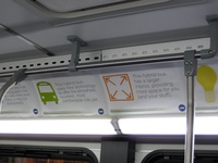 The interior of bus #4015, working route #147 Outer Drive Express, on December 13, 2008. Ad placards inside boasted about the features of the new hybrid buses.