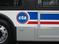 Prototype bus #1000 at Navy Pier during a CTA press conference on November 2, 2005. The 1000-series features the new CTA "dot" logo.
